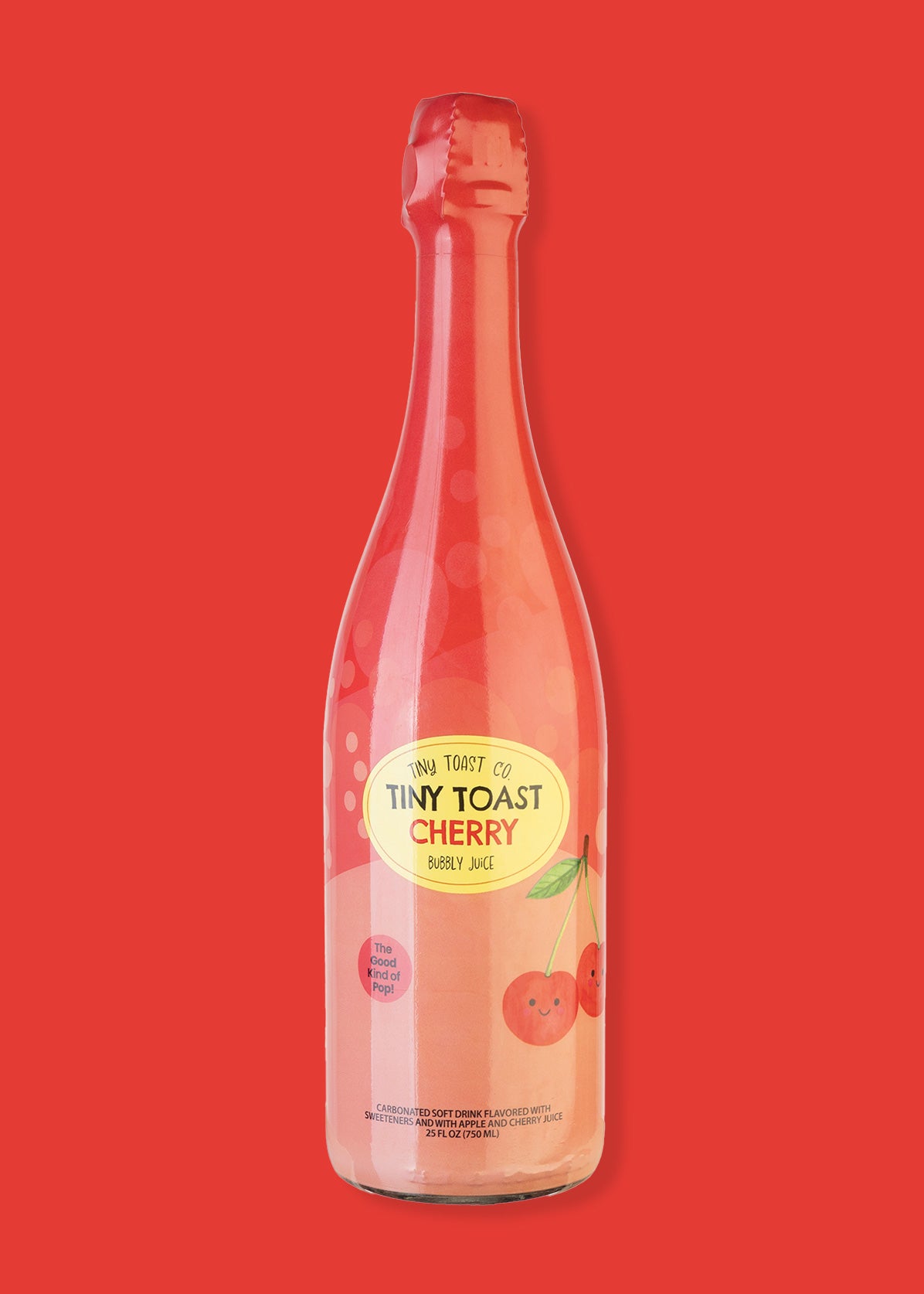 A bottle of Tiny Toast Co. Cherry Soda Sparkling Drink on a solid red background.