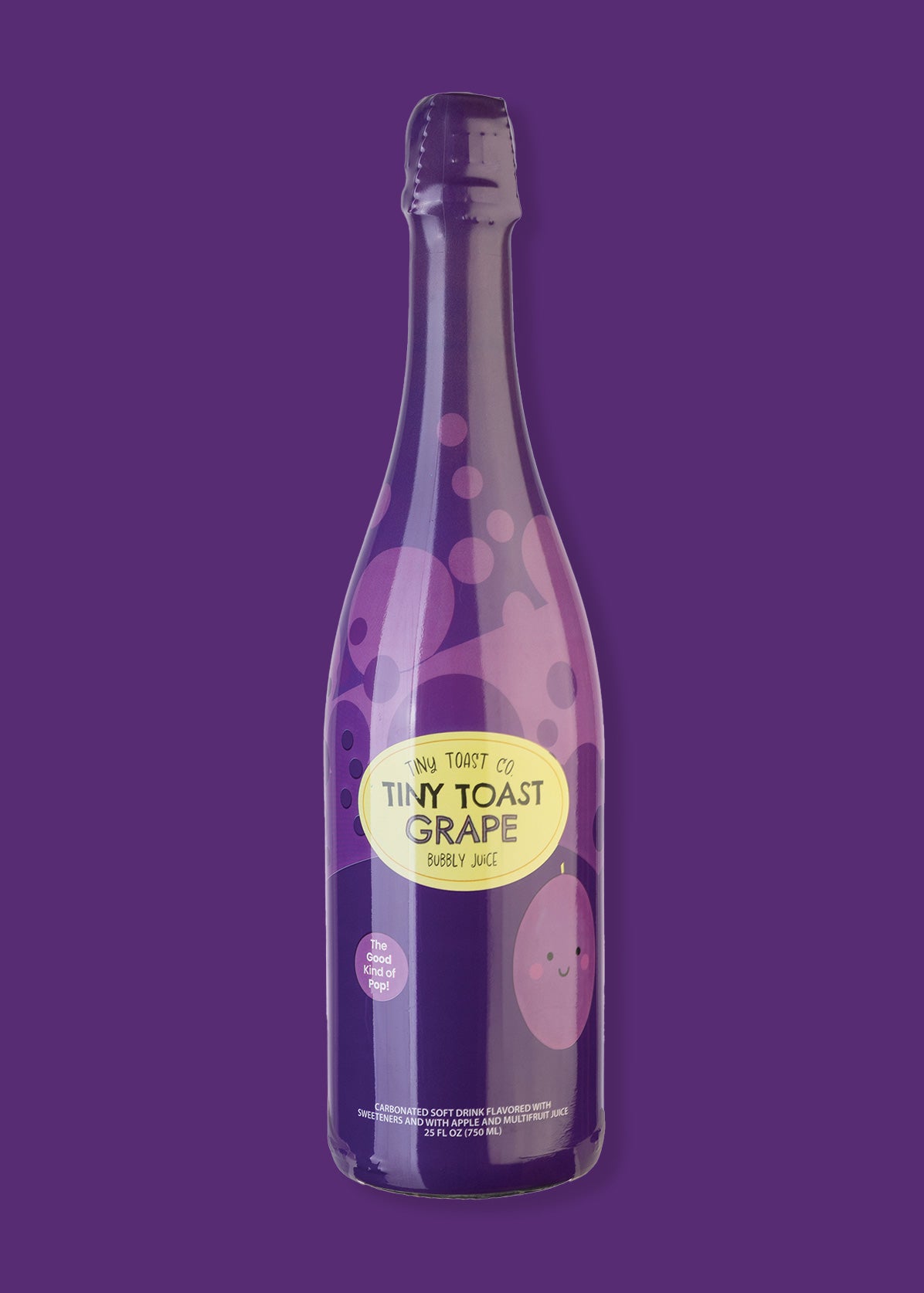 A bottle of Tiny Toast Co. Grape Soda Sparkling Drink on a solid purple background.
