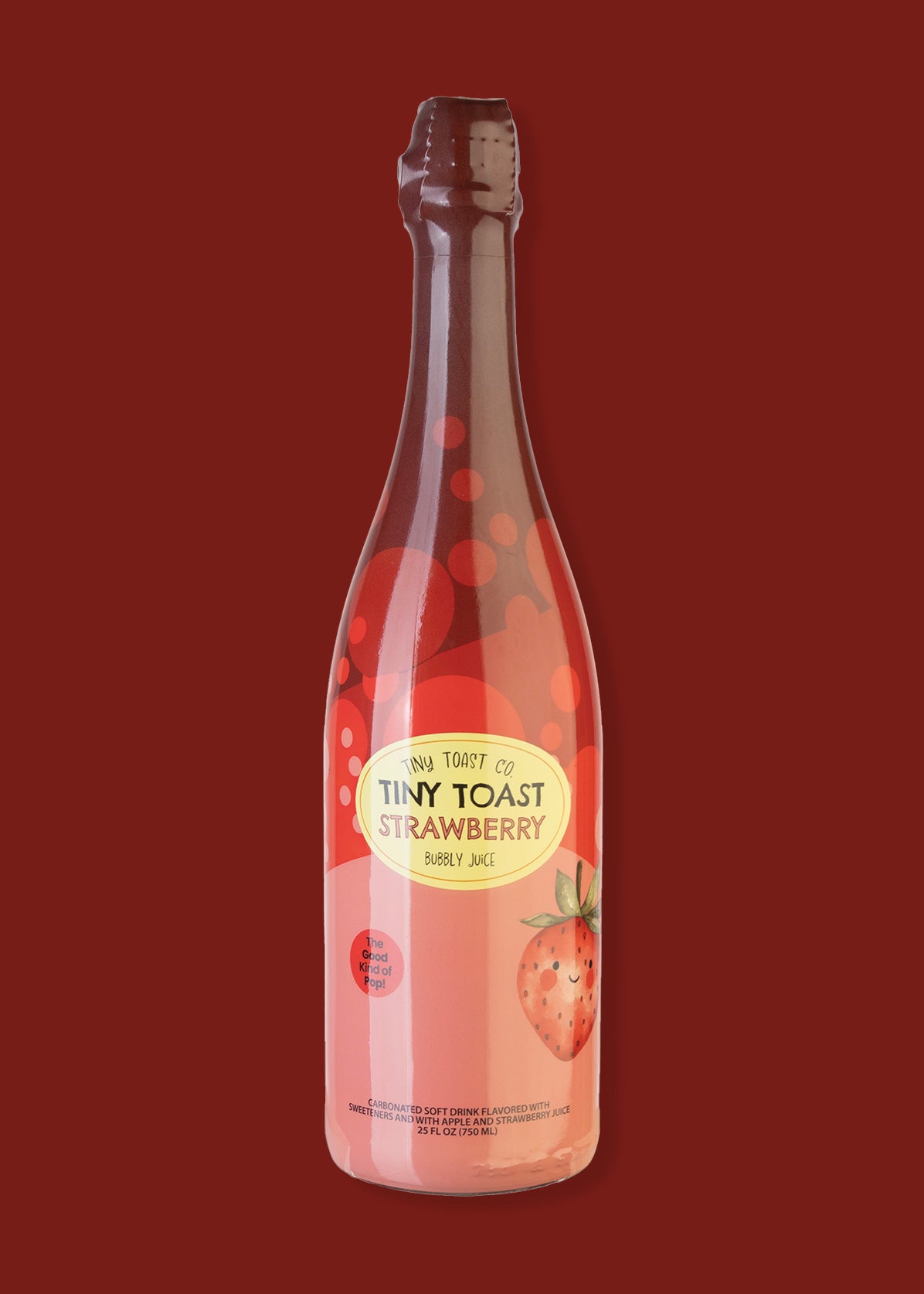 A bottle of Tiny Toast Co. Strawberry Sparkling Juice, featuring a pink liquid and label with a strawberry illustration, set against a solid dark red background.